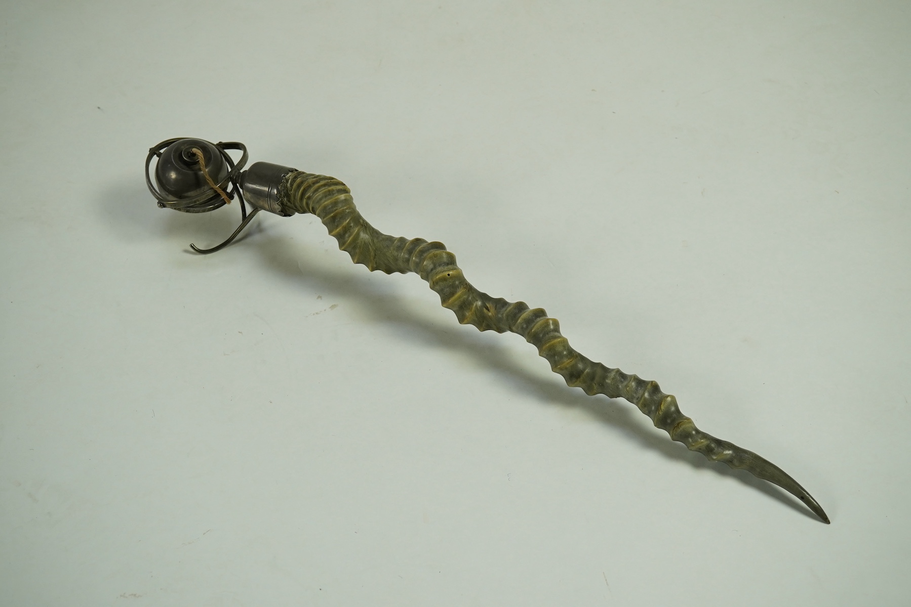 A late Victorian antelope horn handled silver orb shaped gimbal table lighter, by Joseph Braham